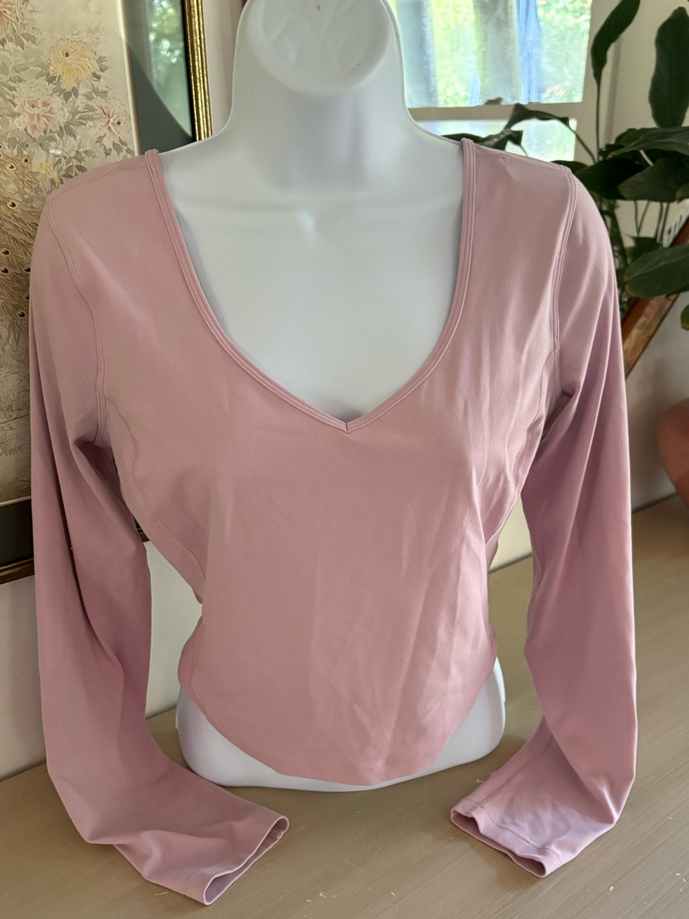 Lululemon Align Long Sleeve Shirt features a V-neck and a cropped fit